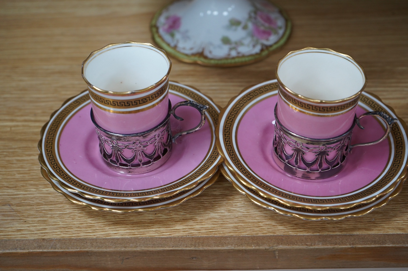 A French porcelain part dessert service together with a set of four Aynsley cups and saucers, the cups with silver holders. Condition - varies, some repairs